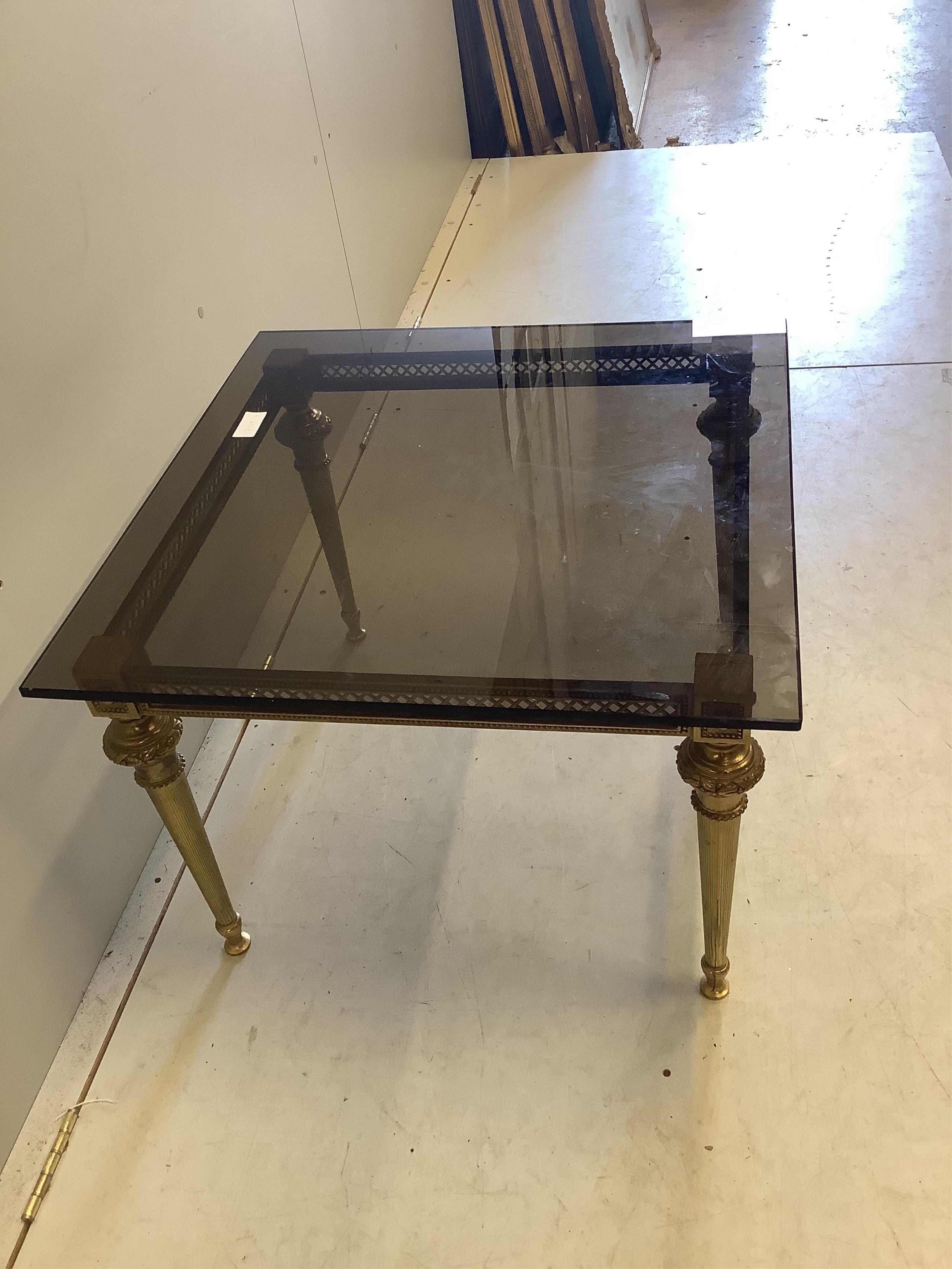 A rectangular gilt metal smoked glass occasional table, width 65cm, depth 65cm, height 46cm. Condition - good